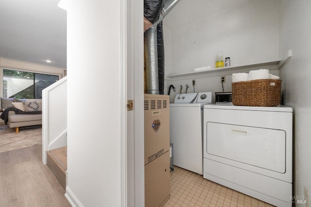 19 Savannah Ave, San Anselmo, CA 94960 - laundry area with washer and clothes dryer, wood finished floors, and laundry area