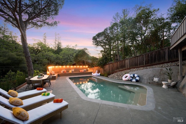 19 Savannah Ave, San Anselmo, CA 94960 - pool at dusk featuring a fenced backyard, outdoor lounge area, a fenced in pool, and a patio