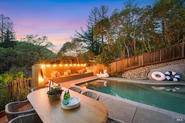 19 Savannah Ave, San Anselmo, CA 94960 - pool at dusk with a patio, a fenced backyard, a fenced in pool, and outdoor dining area