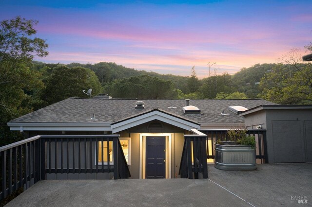 19 Savannah Ave, San Anselmo, CA 94960 - view of front of house with board and batten siding and a shingled roof