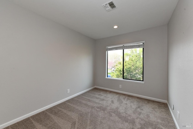 unfurnished room featuring carpet flooring, baseboards, visible vents, and recessed lighting