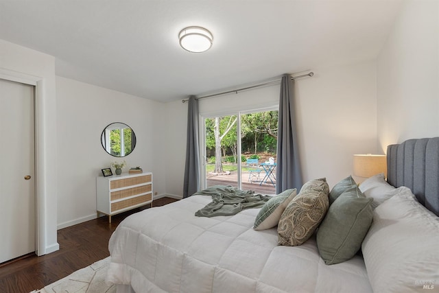 bedroom with access to outside, baseboards, and wood finished floors