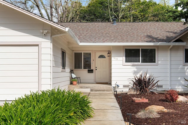 entrance to property with crawl space and a shingled roof