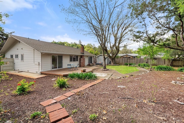 view of yard featuring a storage unit, a fenced backyard, a patio area, and an outdoor structure
