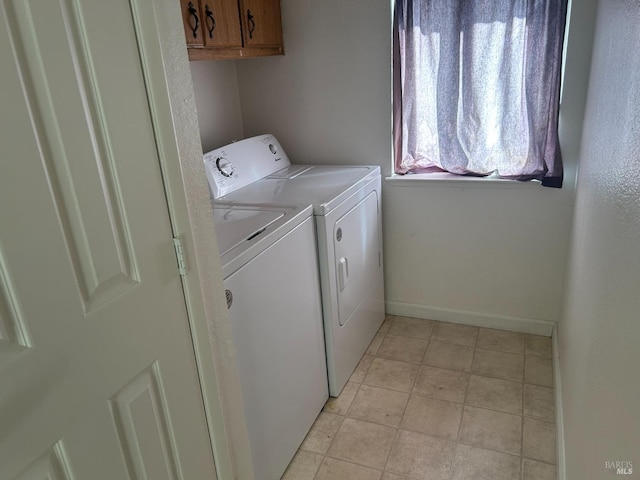 336 Hamilton Dr, Fairfield, CA 94533 - laundry room featuring washer and dryer, cabinet space, baseboards, and light tile patterned floors