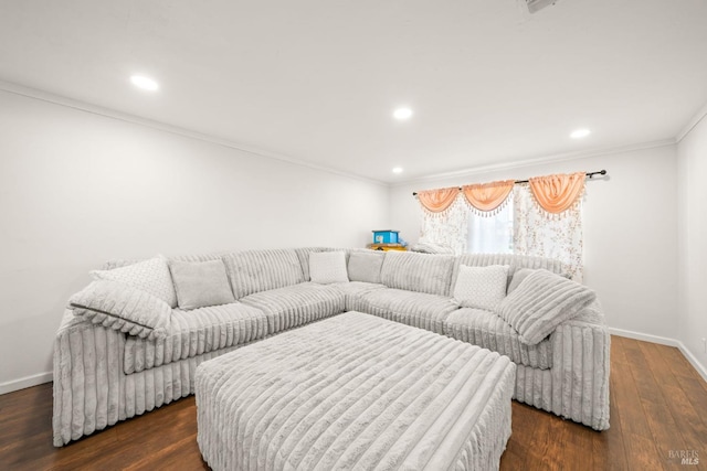 living room featuring dark wood-type flooring, crown molding, baseboards, and recessed lighting