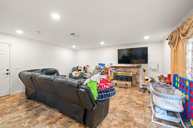 living room featuring recessed lighting, stone finish floor, and visible vents