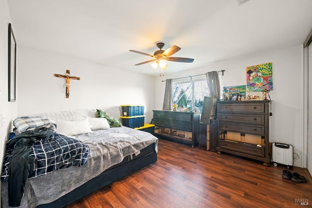 bedroom featuring ceiling fan and wood finished floors