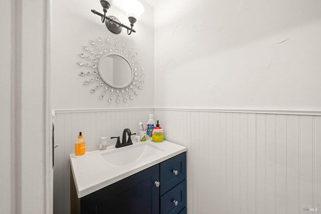 bathroom with vanity and wainscoting