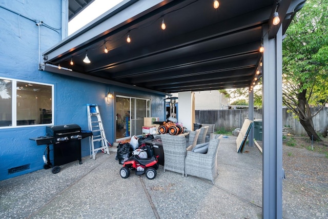 view of patio / terrace featuring grilling area and fence