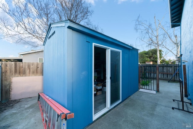 view of outbuilding with an outbuilding and a fenced backyard