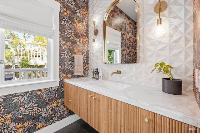 bathroom featuring vanity and decorative backsplash