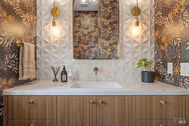 bathroom with visible vents and a sink