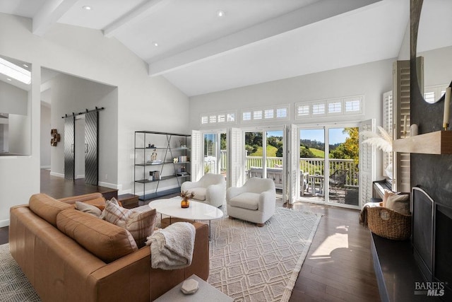 living area with high vaulted ceiling, a barn door, baseboards, beam ceiling, and hardwood / wood-style flooring