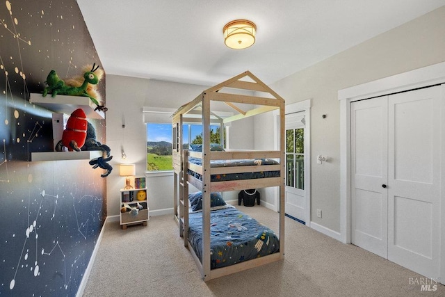 carpeted bedroom with baseboards