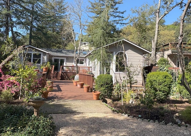 view of front facade with a wooden deck