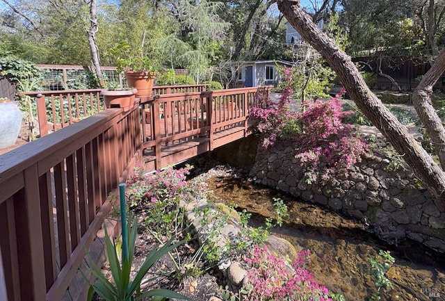 wooden deck featuring fence