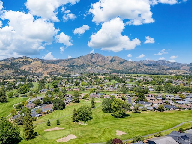 aerial view featuring a mountain view, a residential view, and view of golf course