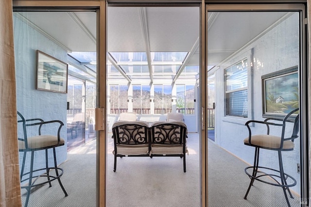 carpeted bedroom featuring a sunroom