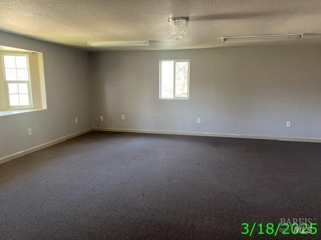 19557 Donkey Hill Rd, Hidden Valley Lake, CA 95467 - spare room featuring a textured ceiling and baseboards