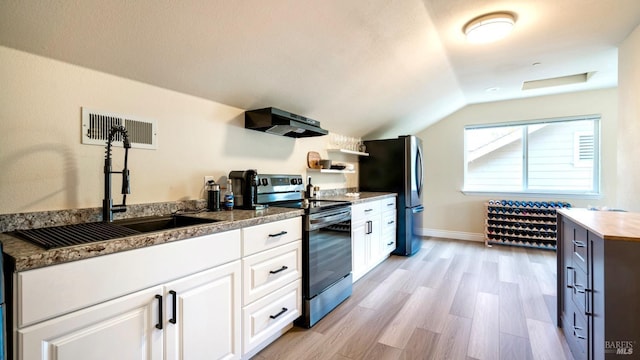 kitchen with exhaust hood, visible vents, vaulted ceiling, a sink, and stainless steel appliances