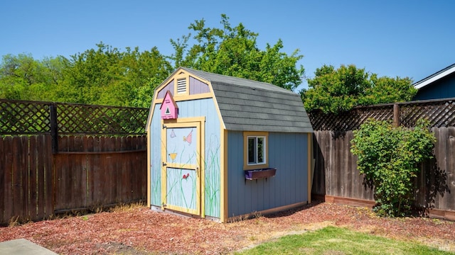 view of shed with a fenced backyard