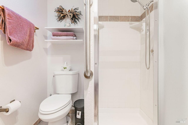 full bath with toilet and a shower stall