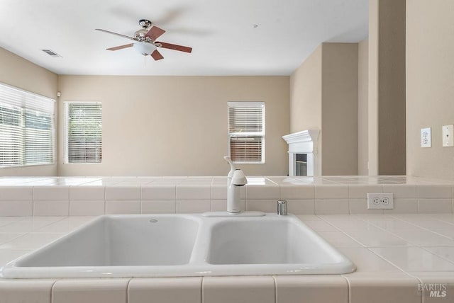 room details with a ceiling fan and visible vents
