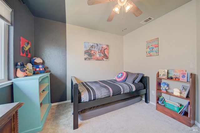 bedroom featuring baseboards, a ceiling fan, visible vents, and carpet floors