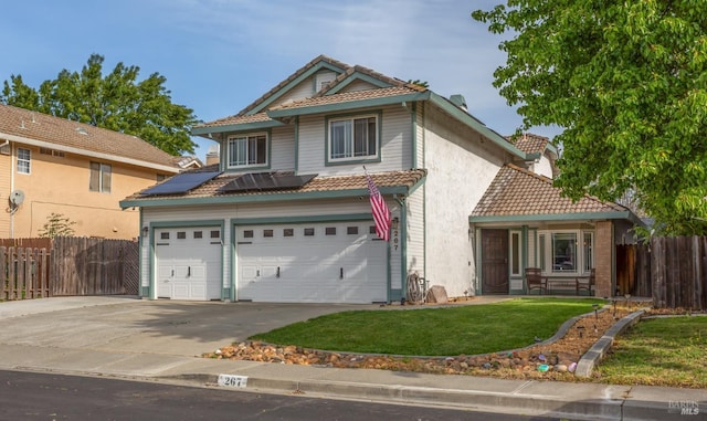 view of front of house with a tiled roof, an attached garage, fence, and driveway
