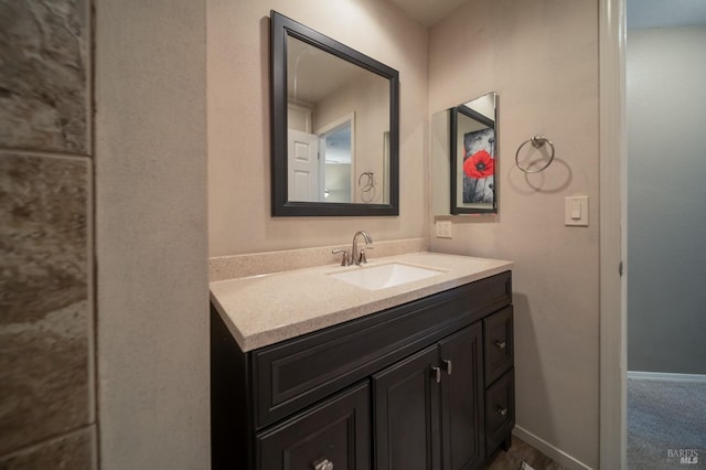 bathroom featuring vanity and baseboards