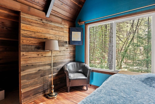 bedroom with wood ceiling, multiple windows, wood finished floors, and lofted ceiling