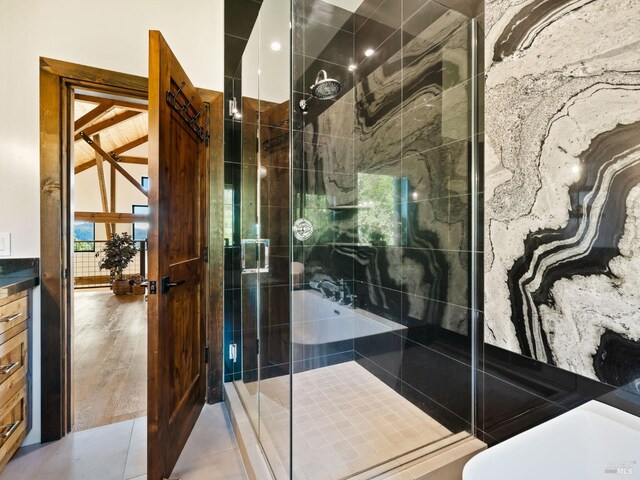full bath featuring a shower stall
