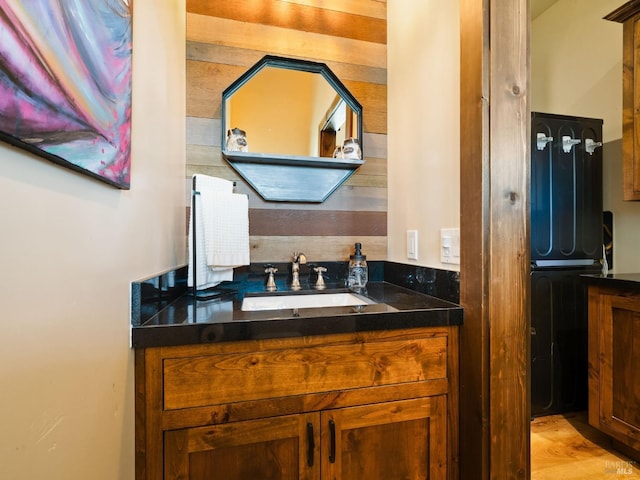 bathroom with vanity and wood finished floors