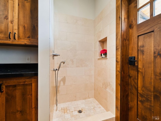 full bathroom with a tile shower