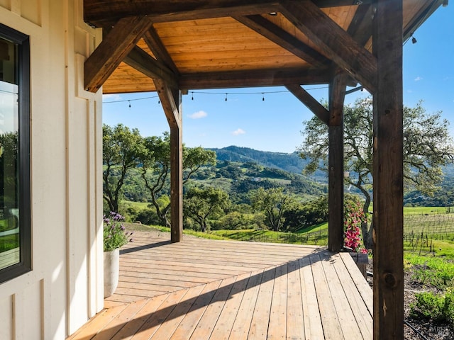 wooden terrace featuring a mountain view