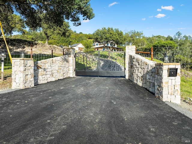 view of gate featuring fence
