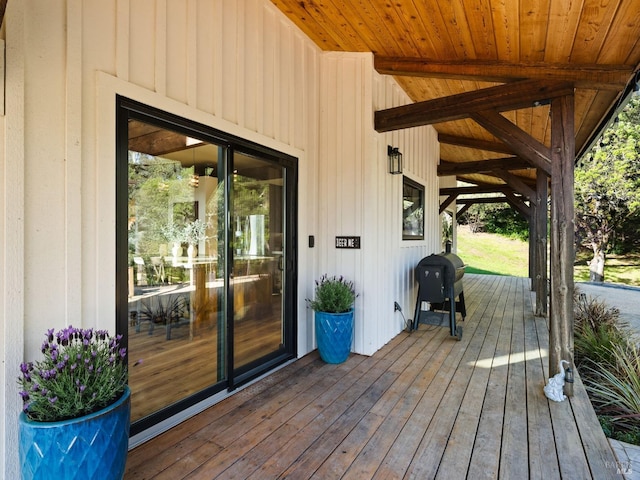 wooden terrace featuring area for grilling
