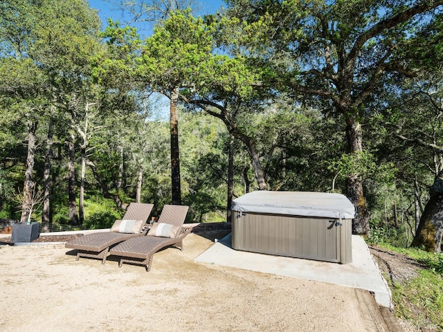 view of patio with a hot tub