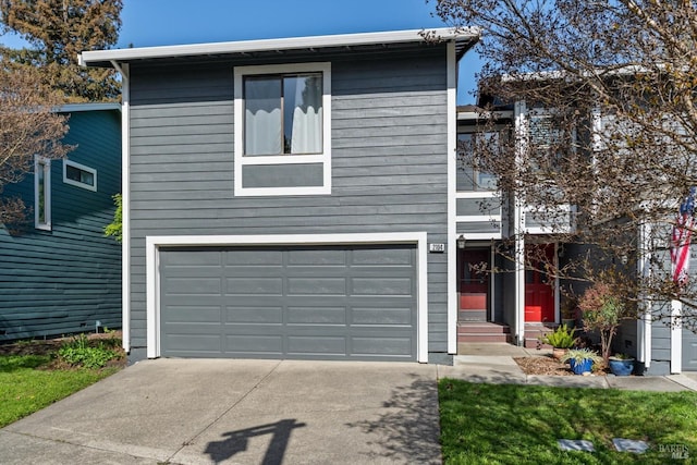 view of front facade featuring an attached garage and driveway