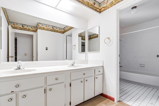 full bathroom featuring shower / bathtub combination, baseboards, a sink, and double vanity