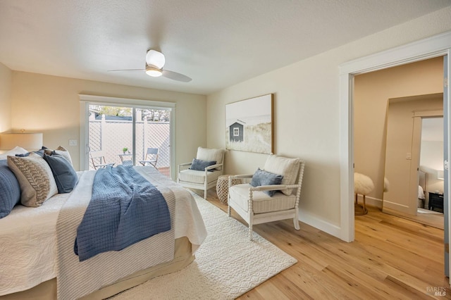 bedroom featuring light wood-style flooring, access to outside, baseboards, and a ceiling fan