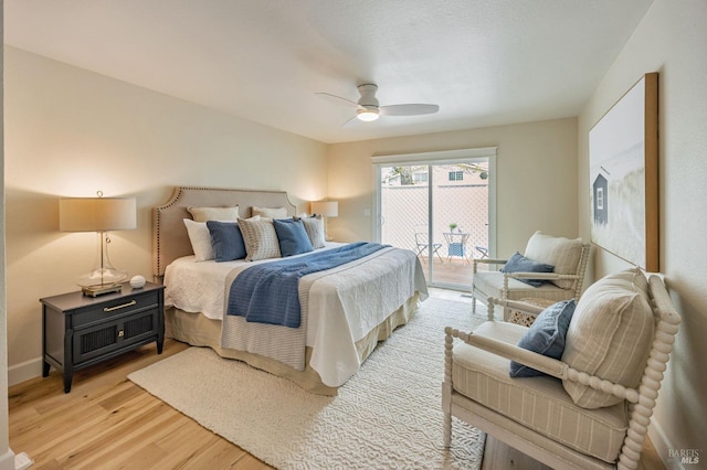 bedroom with access to outside, light wood finished floors, ceiling fan, and baseboards