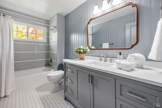 bathroom with toilet, shower / bath combo, and vanity