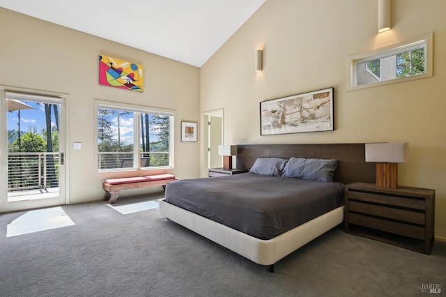 carpeted bedroom with high vaulted ceiling and access to exterior
