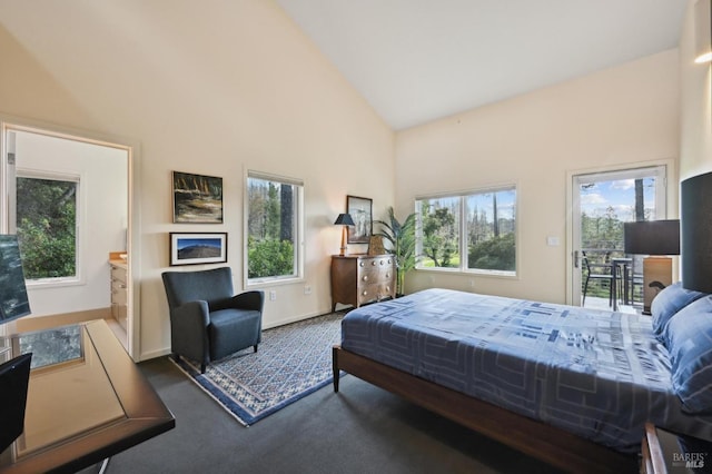 bedroom with access to exterior, carpet flooring, multiple windows, and high vaulted ceiling