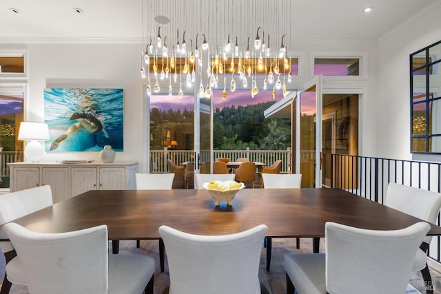 dining space featuring an inviting chandelier, ornamental molding, and recessed lighting