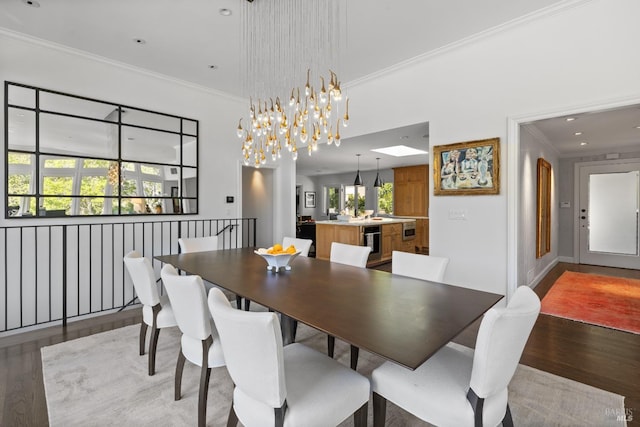 dining space with recessed lighting, ornamental molding, and light wood-style floors