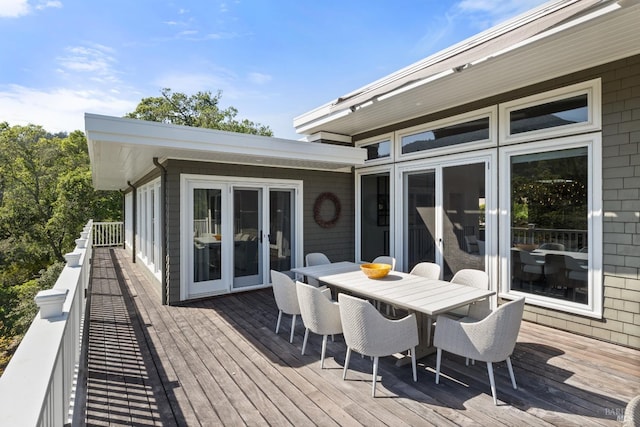 wooden deck featuring outdoor dining area