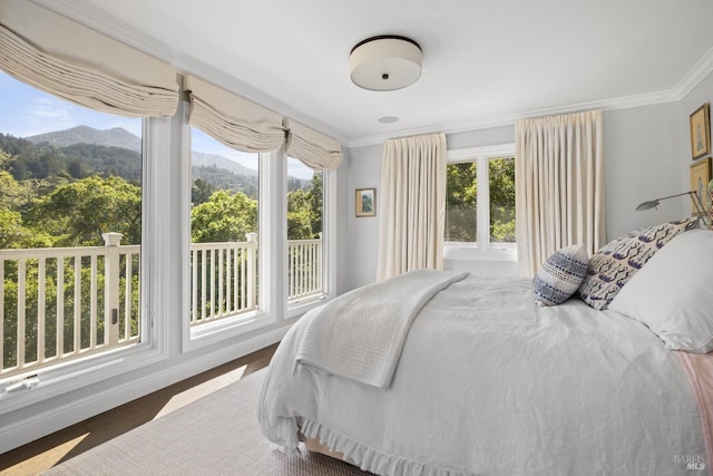 bedroom featuring a mountain view and ornamental molding